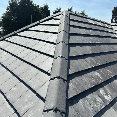 Professional gutter clearing service from ladder