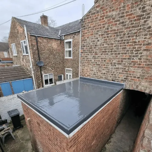 Close-up of grey slate roof tiles showing quality repair work