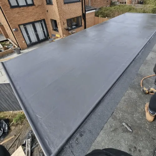 Aerial view of house with dark grey roof installation